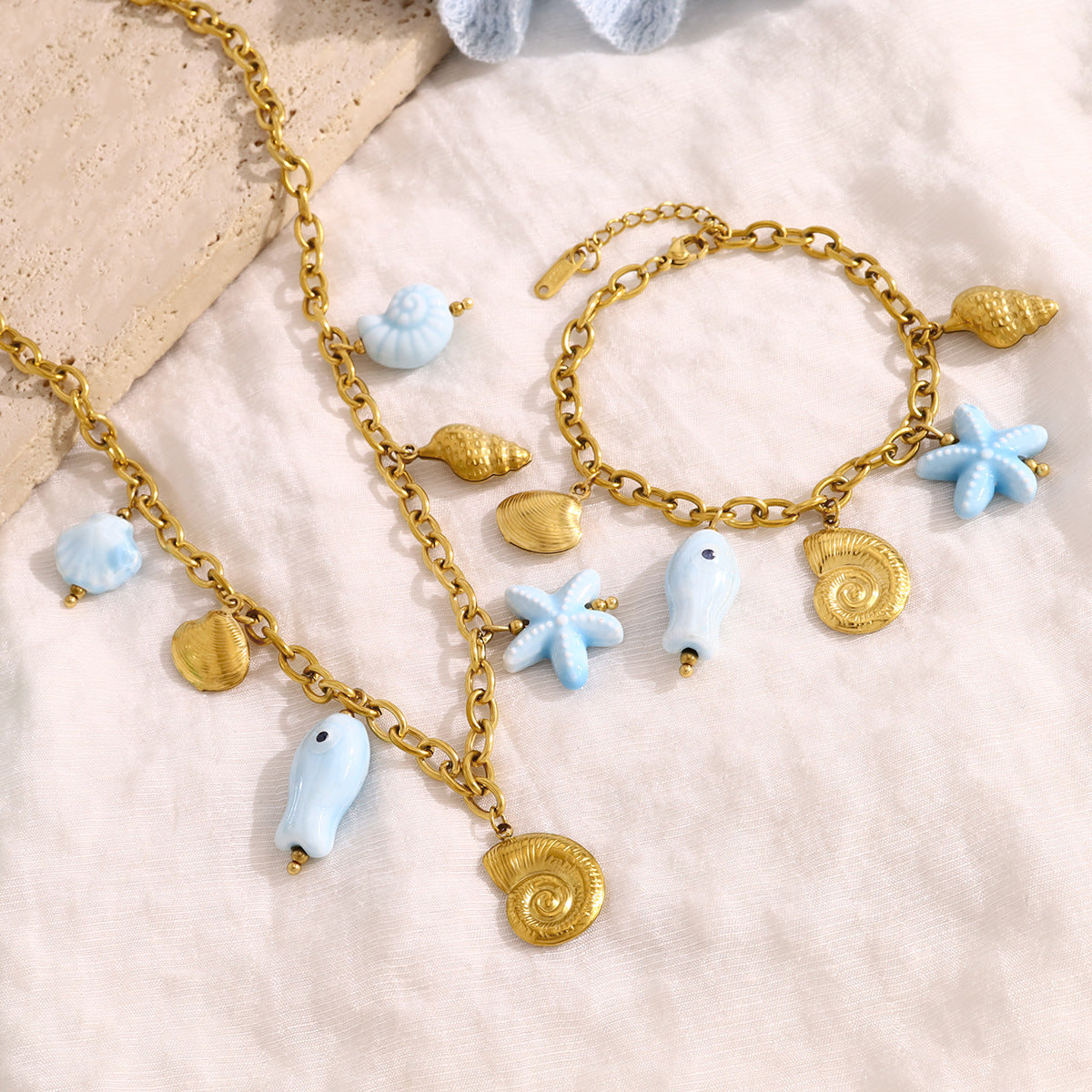 18K Gold Plated Stainless Steel Creative Ocean Style Starfish, Shell, and Seahorse Pendant Necklace & Bracelet Set